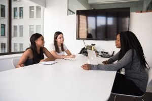 HR Manager talking with two female employees